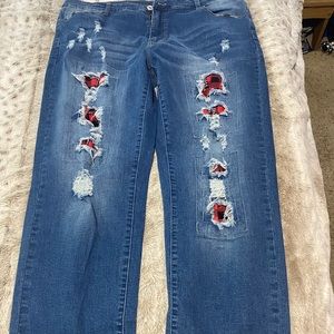 Women’s jeans with red plaid patches